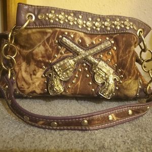 Purple/camo crossing pistols purse